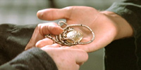 Catherine lends Daniel her amulet
